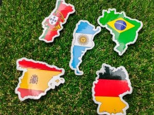 Portugal,German,Spain,Argentina and brazil flag sticker is on a green field.
